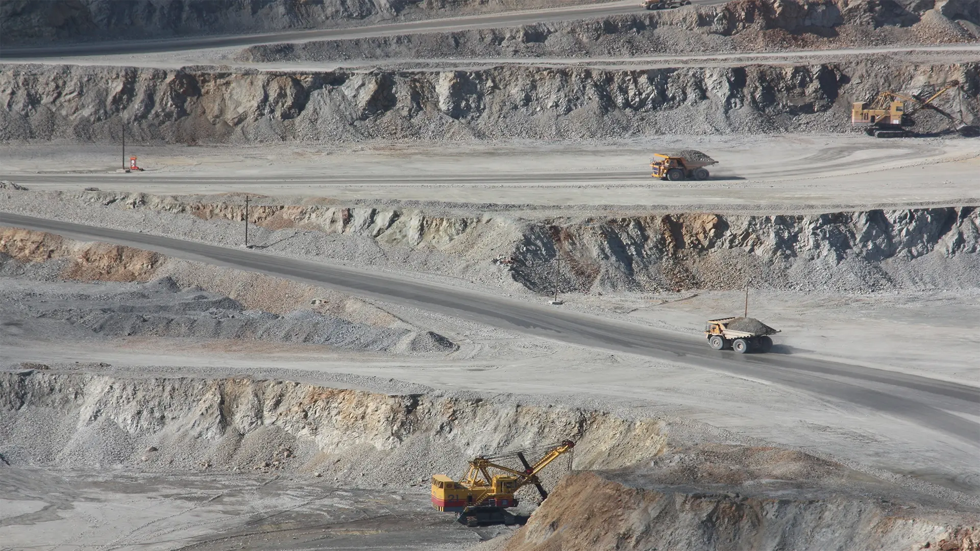 Trucks within a mine transporting ore