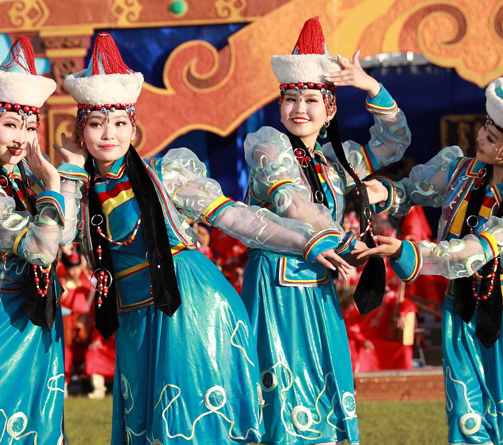 Two women in Mongolian attire performing a Folk dance